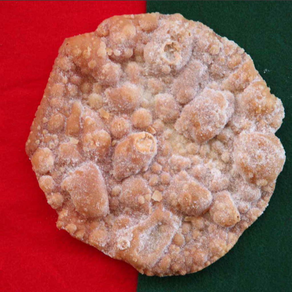 A picture of a buñuelo, a mexican fritter.